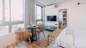 Our studio counts with a flat screen TV and an AC unit, for your entertainment and comfort #style #vibrant