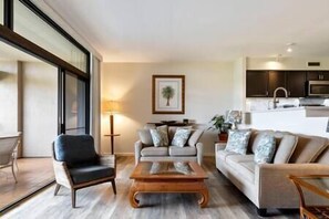 Beautiful coastal style sunken living room leading to lanai