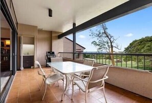 Ocean view lanai with wet bar, BBQ, and dining area.