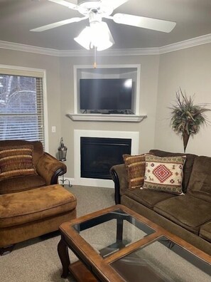 Living roon seatng , gas log fireplace and Smart TV