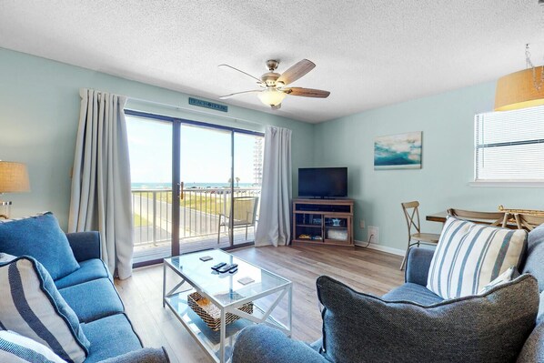 Relax in our cozy living room and enjoy your favorite TV show or movie on the smart TV, offering both cable and streaming options.