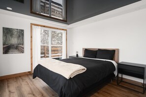 First bedroom on the upper floor, King bed.

