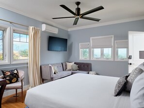 Wake up to island vibes in this bright bedroom. Comfort & calm await. Your peaceful escape.