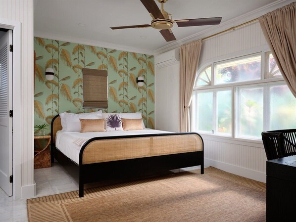 Escape to the dreamy Ilima Suite! Lush tropical vibes & cozy elegance await your relaxing getaway. Book your slice of paradise!