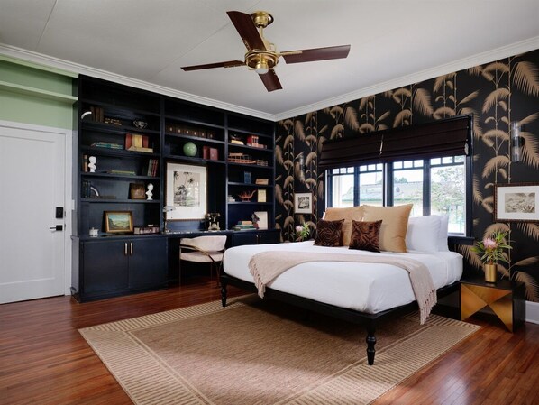 Timeless elegance meets island charm in this Lokelani Suite at The Historic Wailuku Inn. Cozy up with a book, sink into plush comfort, and experience pure relaxation.