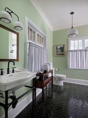 Start your day in this spa-inspired bathroom—vintage charm, luxe towels, and natural light make it feel like your own private sanctuary.