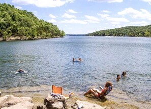 Embracing Nature's Playground: Swim, Float, and Fish at our pebble rock beach right here at the resort