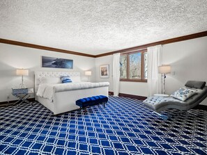 Serene Bedroom Retreat: Unwind in this cozy bedroom featuring soft, luxurious linens, ample natural light, and a touch of modern elegance.