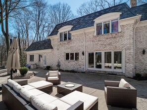 Tranquil Garden Oasis: Escape to our lush garden with vibrant greenery, a charming seating area, and the soothing sounds of nature.