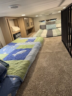 One loft with queen and a twin with memory foam bed toppers