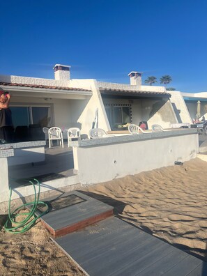 Hose to wash sandy beach feet.