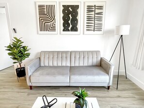 Contemporary Livingroom:
- 55” Smart TV 
- Sleeper Sofa
- City View
