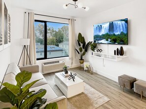 Contemporary Livingroom:
- 55” Smart TV 
- Sleeper Sofa
- City View