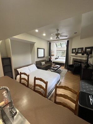 Three queen-size beds - one in the alcove, a Murphy bed, and sleeper sofa