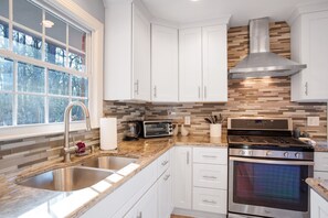 Kitchen with gas range and oven