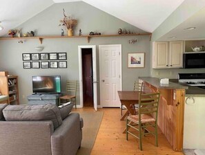 primary living room with new smart tv, one of two