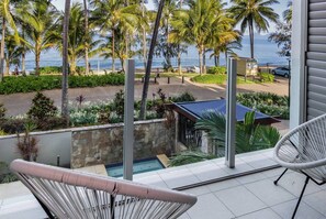 The balcony overlooks the beach and complex's pool below.