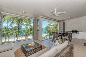 Enjoy uninterrupted ocean views between swaying palms from your private balcony. 