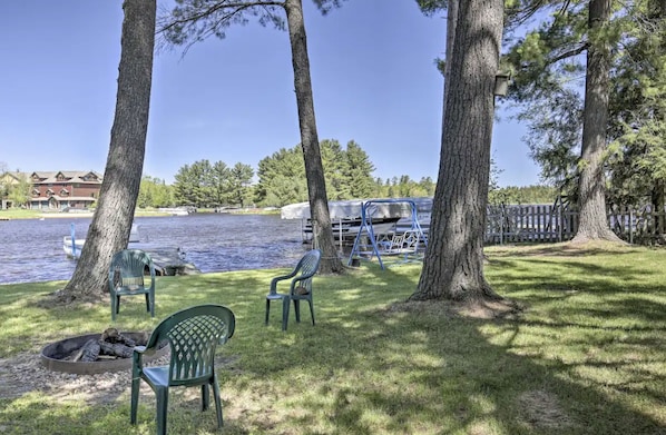 Enjoy waterfront view from the private, sprawling backyard of The Sandbar Lakehouse
