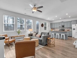 Kitchen, living, dining combo. Deck is off the kitchen (door between the windows