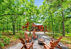 Gather by the fire pit for an evening of relaxation, warmth, and comfort at our luxurious cabin.
