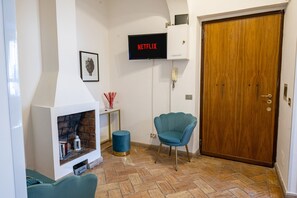 Entrance door in the living room with smart TV