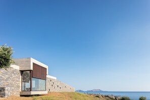 Pared-back exteriors reign supreme at this eco-friendly biophilic retreat.  
