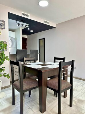 Comfortable dining room table with 4 chairs and 2 high chairs