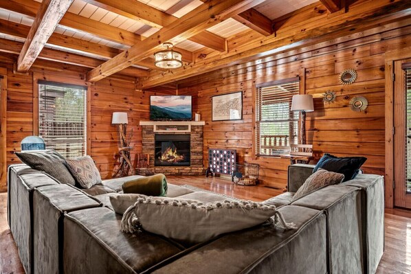 Comfortable sectional furniture, a (seasonal) fireplace, and large Smart TV make the living room the perfect place for your group to enjoy time together.
