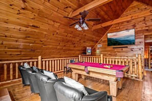 Movie theater space upstairs along with a pool table and arcade games. This space provides hours of fun for the whole group.