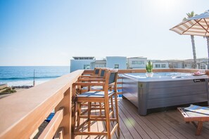 Three stools on the deck invite you to savor the view. Sit, unwind, & enjoy 