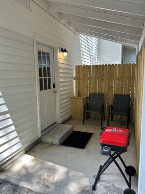 Private Entry with outdoor space and a small gas grill.