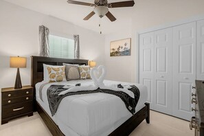 Queen sized bedroom with ceiling fan and   smart TV for self-login!!