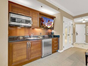 Fully stocked kitchen with sets of cookware.
