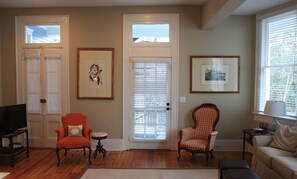 Living room with back door leading to porch.