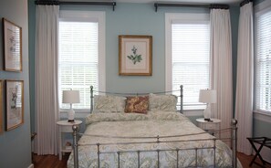 Master bedroom with chest of drawers. Flooded with light.