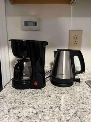 Coffee pot and Electric tea kettle. Coffee,creamer, teas and sugar available