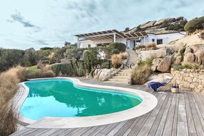 Swimming pool with sun beds and gazebo