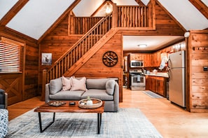 View up towards loft from fireplace.