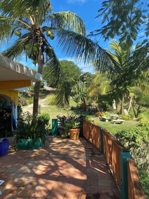Back deck with Bbq and various lounge chairs for relaxation