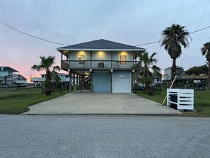 Driveway side (plenty of parking space). No neighbors for privacy.