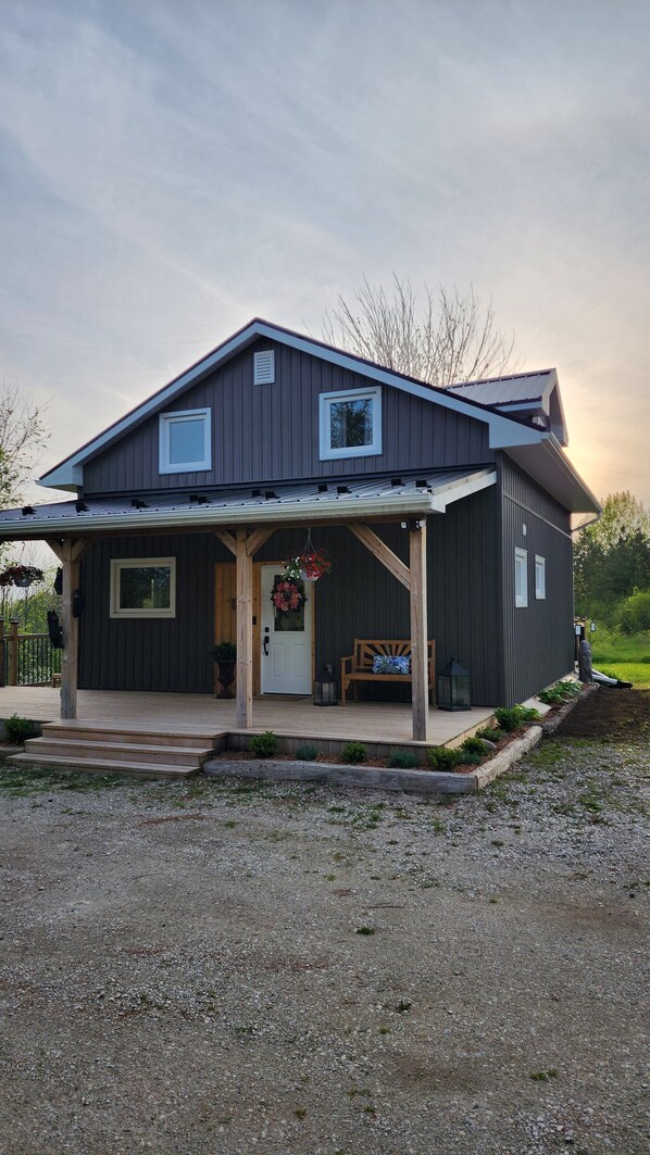 Beautiful covered front porch, perfect spot for your morning coffee!