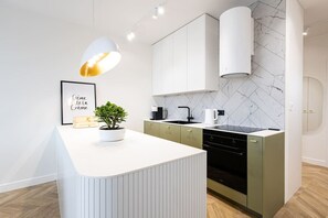 Kitchen island and furnishings - coffee maker and oven and kettle