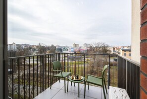 Terrace with coffee area and city view