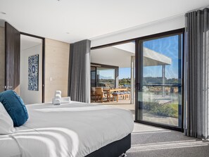 The primary suite extends to the expansive patio.