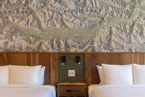 Cozy and inviting beds with plush pillows and a touch of nature-inspired decor.