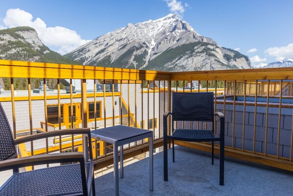 Wake up to majestic mountain views from this serene balcony suite.