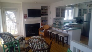 Living Room has either bar stools or glass kitchen table.