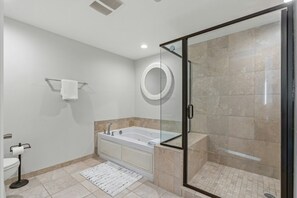 After a fun day on the beach, sink into the soaker tub with a glass of wine.