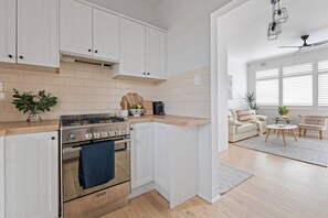Effortlessly entertain in the fully equipped kitchen, seamlessly connected to the living and dining area for gatherings that feel just like home.
